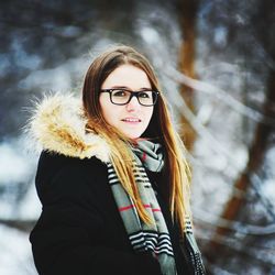 Portrait of young woman in snow