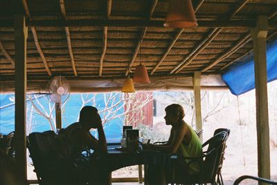 Group of people sitting on table