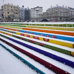 Multi colored city against sky