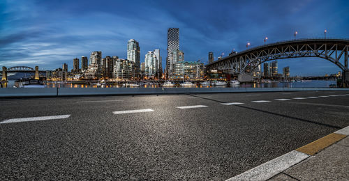 View of bridge and buildings against sky