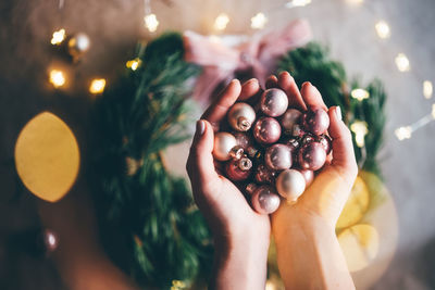 Close-up of hand holding baubles