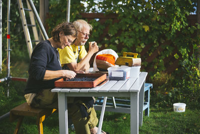 Couple sitting outside