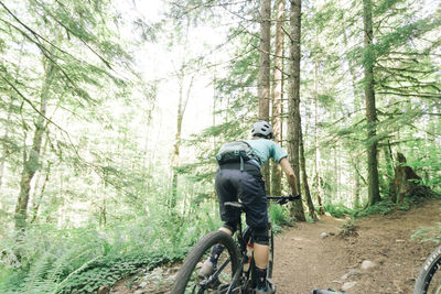 A female biker rides on a trail near sandy, oregon.