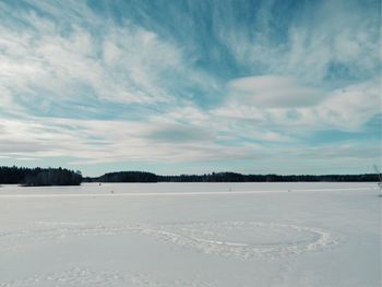 Scenic view of snow covered ses against sky