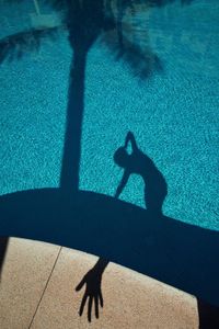 High angle view of shadow on swimming pool