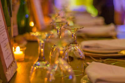 Close-up of illuminated candles on table