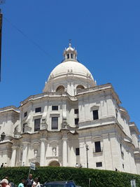 Low angle view of building against blue sky