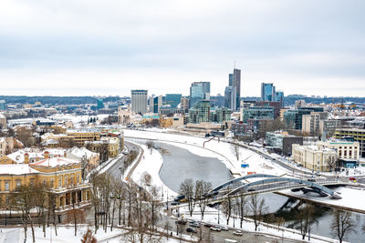 High angle view of city buildings during winter