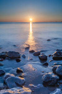 Scenic view of sea during sunset