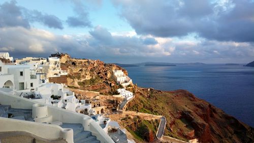 High angle view of buildings by sea