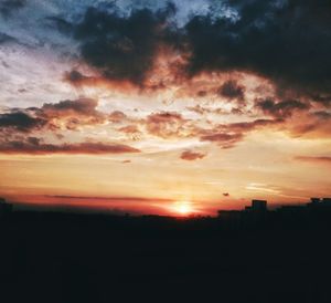 Scenic view of dramatic sky during sunset