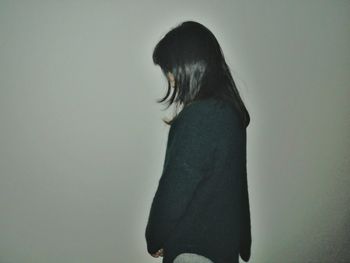 Man standing against white background