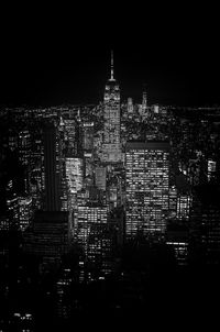 Illuminated buildings in city at night