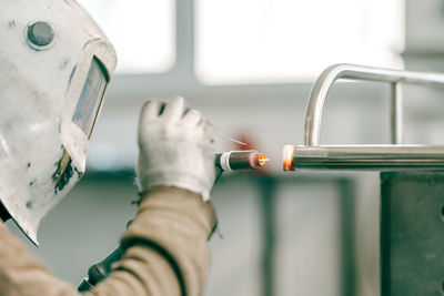 Cropped hand of scientist holding dentures