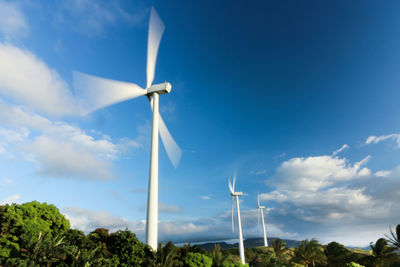 Low angle view of windmill against sky