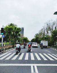 Vehicles on road along buildings