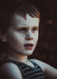 Close-up of thoughtful boy looking away