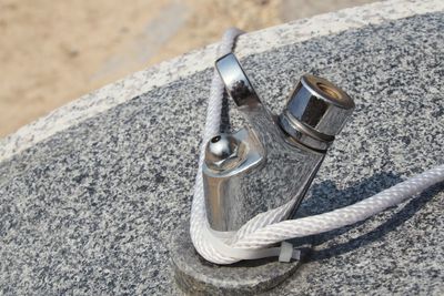 High angle view of wedding rings on rock