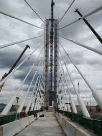 View of bridge against cloudy sky