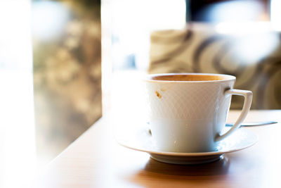 Close-up of coffee cup on table