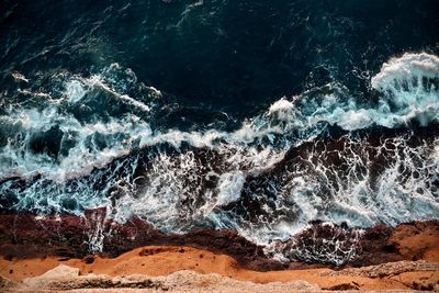 Sea waves splashing on rocks