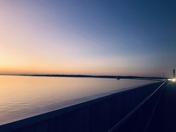 Scenic view of sea against clear sky during sunset