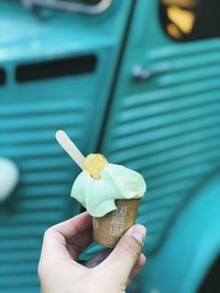 Midsection of person holding ice cream