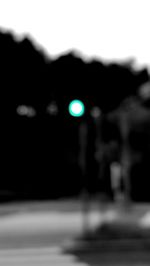Defocused image of illuminated road at night