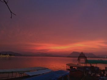 Scenic view of sea against orange sky