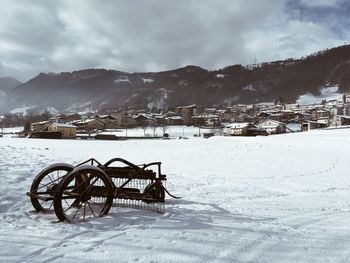 Scenic view of field against sky during winter