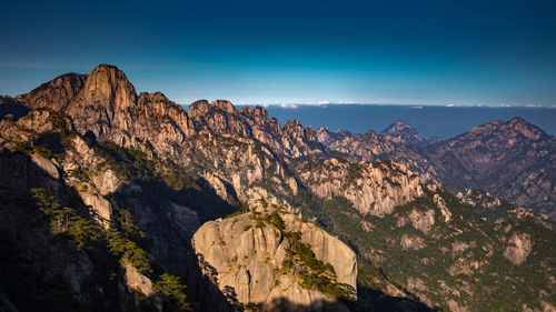 Scenic view of rocky mountains against sky