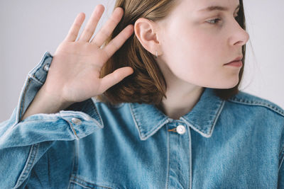 Portrait of a young woman looking away