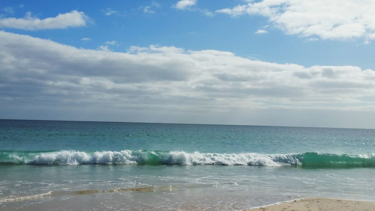 sea, water, horizon over water, sky, wave, beach, scenics, surf, beauty in nature, shore, tranquil scene, tranquility, nature, cloud - sky, motion, idyllic, cloud, cloudy, seascape, day