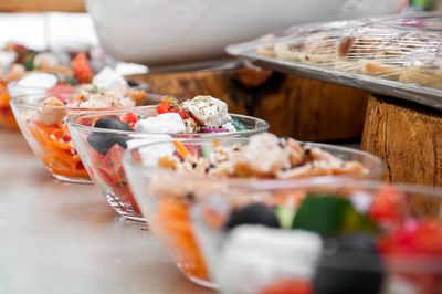 Close-up of salad in bowls on table at store for sale