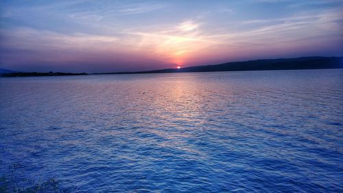 Scenic view of sunset over sea