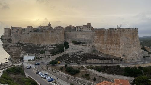 High angle view of old town against sky during sunset