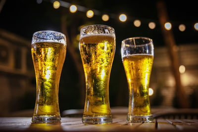 Close-up of beer glass on table