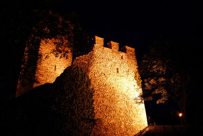 Low angle view of illuminated building at night