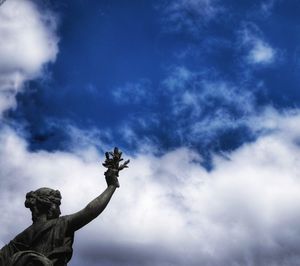 Low angle view of statue against sky