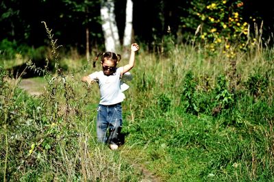 Full length of boy standing on field