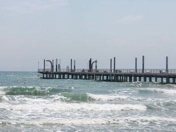 Pier on sea against sky