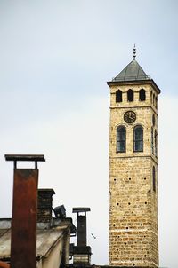 Low angle view of bell tower against sky