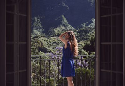 Woman standing on balcony