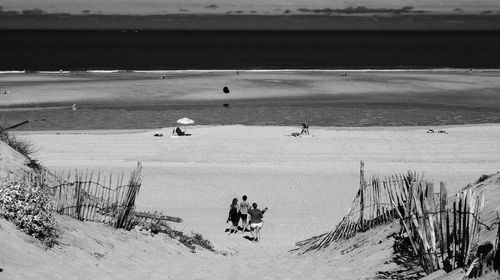 High angle view of people walking on beach