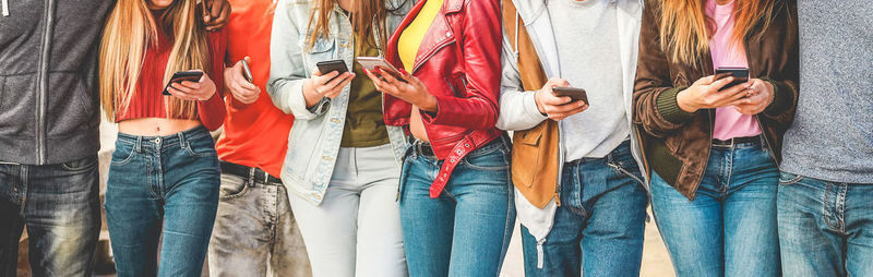 Group of people standing in row