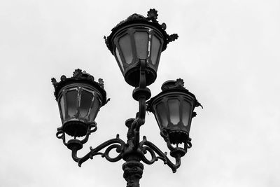 Low angle view of street light against sky