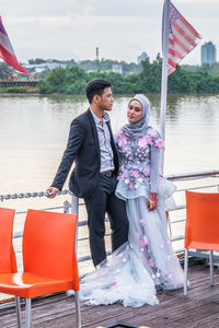 Young couple kissing in water