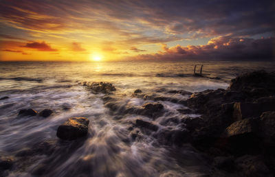 Scenic view of sea against sky during sunset