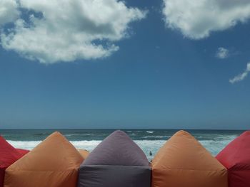 Low section of people relaxing on beach