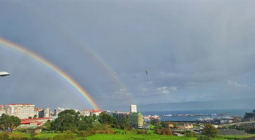 Scenic view of rainbow over landscape